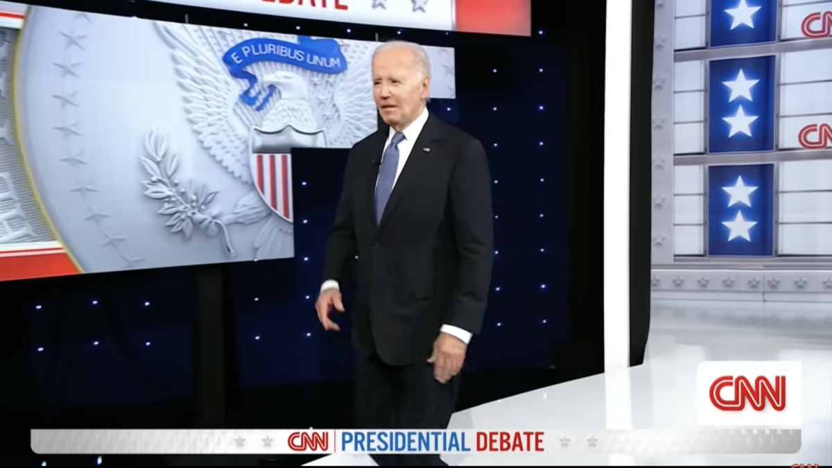 President Joe Biden takes the stage during the presidential debate